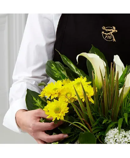Designed Blooming And Green Plants In A Basket 